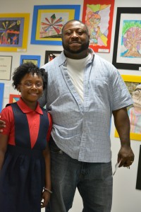 Daughter and father enjoy the art show