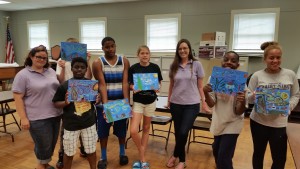Some residents of the Brantwood Children's Home show off their Van Gogh-inspired "Starry Night" creations.