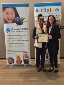 Media Star Dawna Kelly accepts her Abrakadoodle in the Media Award from Rosemarie Harnett.