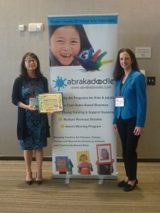 Alice Wang, CEO of Abrakadoodle, representing China, accepted the International Purple Tree Award.