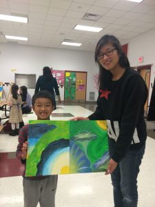 At Moorefield Station Elementary School, this mom and her son beam when presenting their "My Masterpiece with My Parent" art!