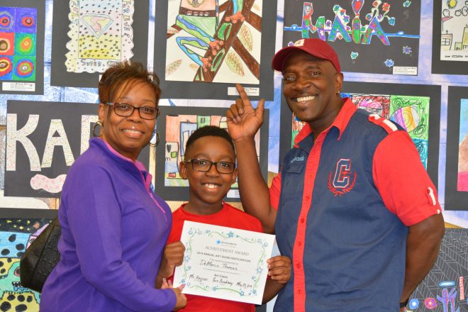 Mom dad and son with art