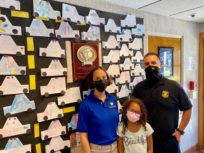 Patrolman Timothy Richard with Laura and Zoey Shabazz